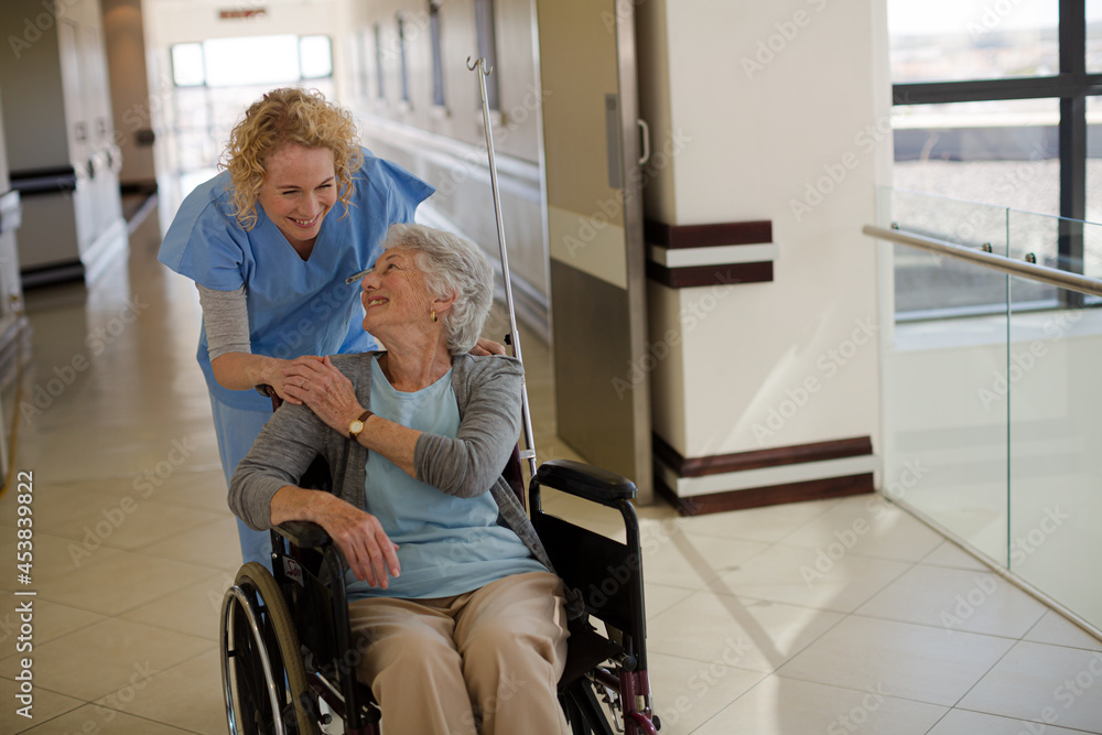 Portrait of smiling nurse and elderly patient in wheelchair Portrait of smiling nurse and elderly patient in wheelchair