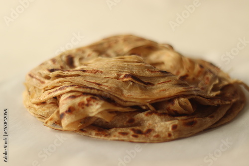 Parotta or Porotta is a layered flatbread made from Maida or Atta, alternatively known as flaky ribbon pancake. It is a favourite food item of Kerala photo