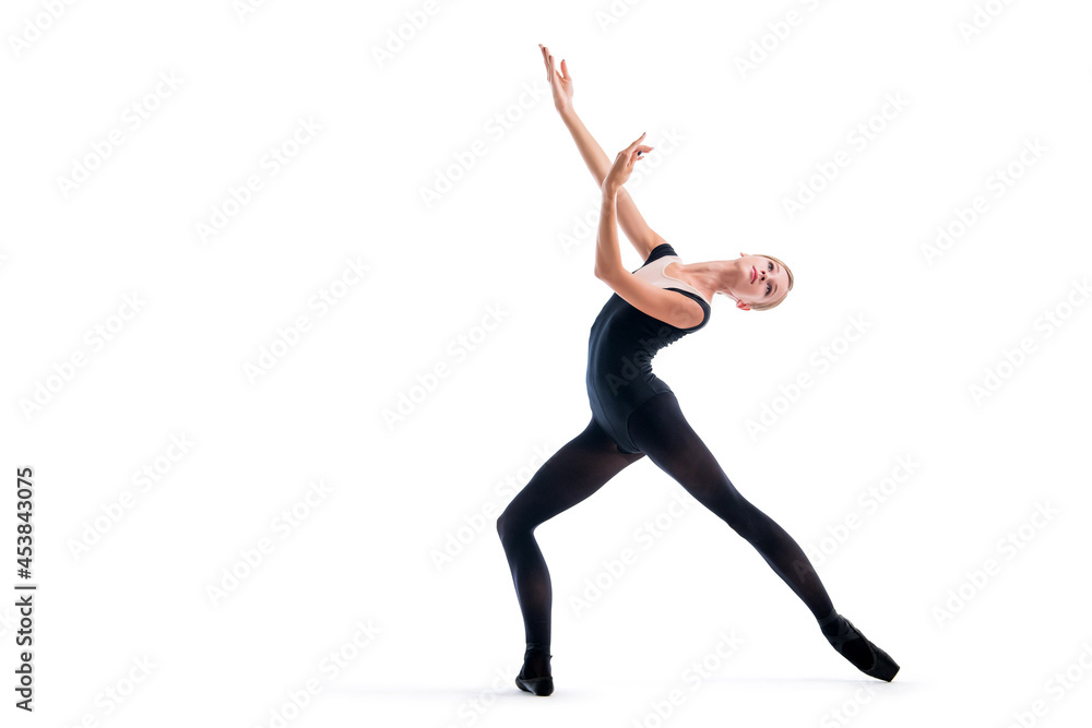 young ballerina in black pointe shoes and leotards posing in graceful pose, isolated on white background young ballerina in black pointe shoes and leotards posing in graceful pose, isolated on white background