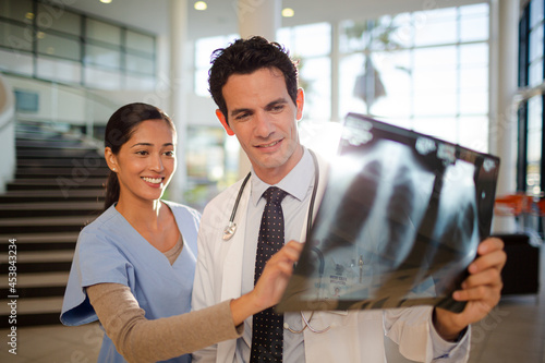 Doctor and nurse viewing chest x-rays