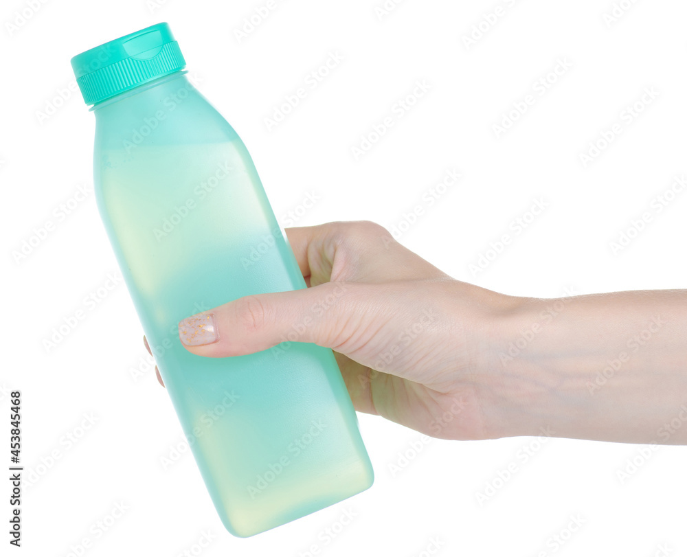 Green beauty bottle shampoo shower gel in hand on white background isolation Green beauty bottle shampoo shower gel in hand on white background isolation