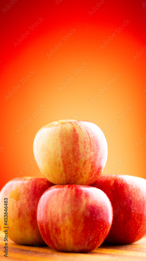 Large fresh red apple on red background gala schnico brookfield mema