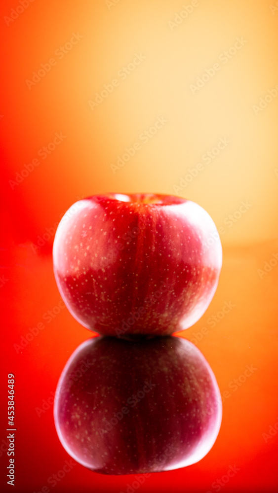 Large fresh red apple on red background gala schnico brookfield mema