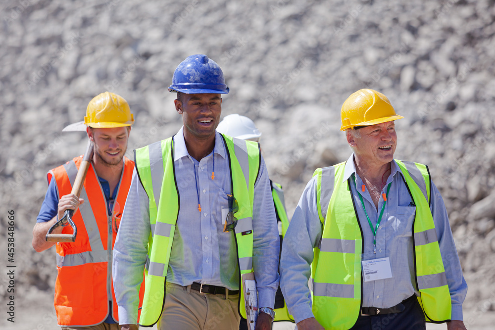 Workers smiling together in quarry Workers smiling together in quarry