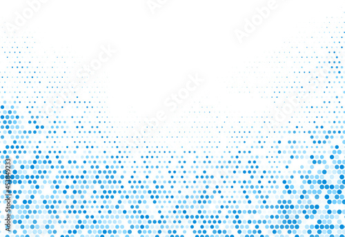 Abstract blue halftone dotted background.