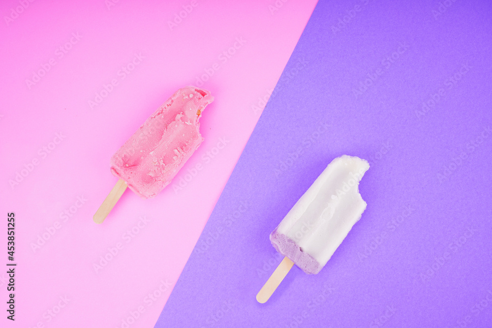 Collection of taro and strawberry flavored ice creams on a purple, pink background. Collection of taro and strawberry flavored ice creams on a purple, pink background.
