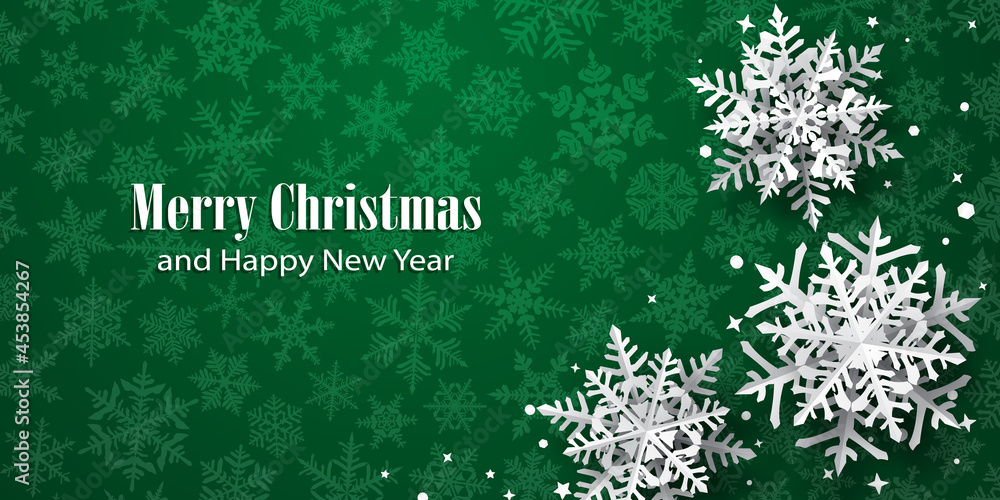 Christmas background of paper snowflakes with soft shadows, white on green background with falling snow Christmas background of paper snowflakes with soft shadows, white on green background with falling snow