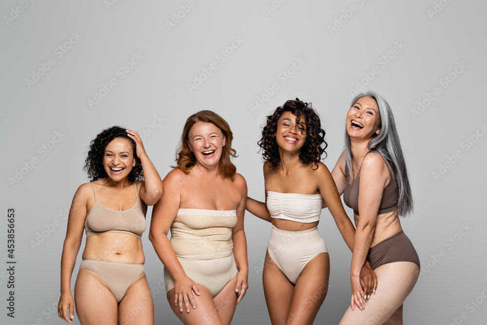 Cheerful multicultural body positive women in lingerie isolated on grey  Stock-Foto | Adobe Stock