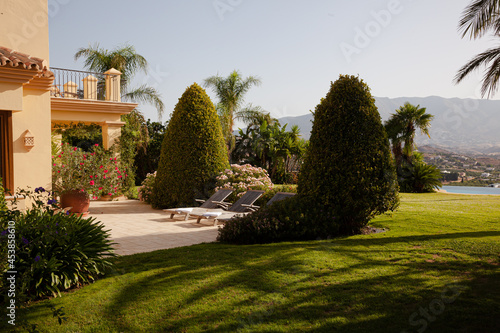 Garden surrounding courtyard doorway of luxury villa