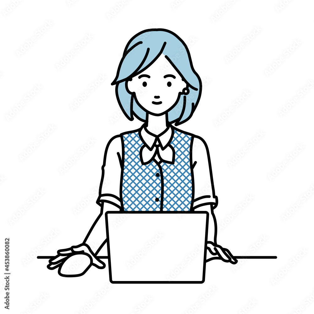 デスクで座ってPCを使っている事務員制服の女性 デスクで座ってPCを使っている事務員制服の女性