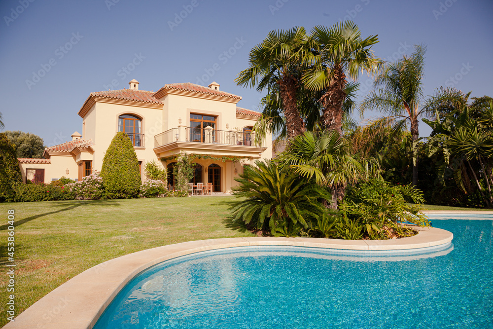 Luxury swimming pool and Spanish villa