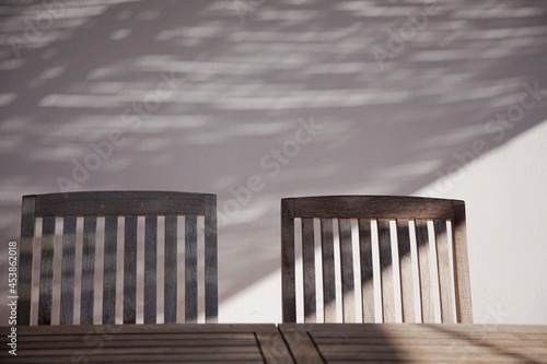 Wooden table and chair in sunlight