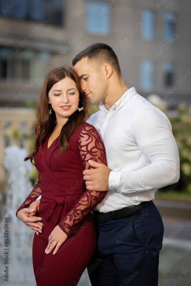 Young couple in love hugging in the city