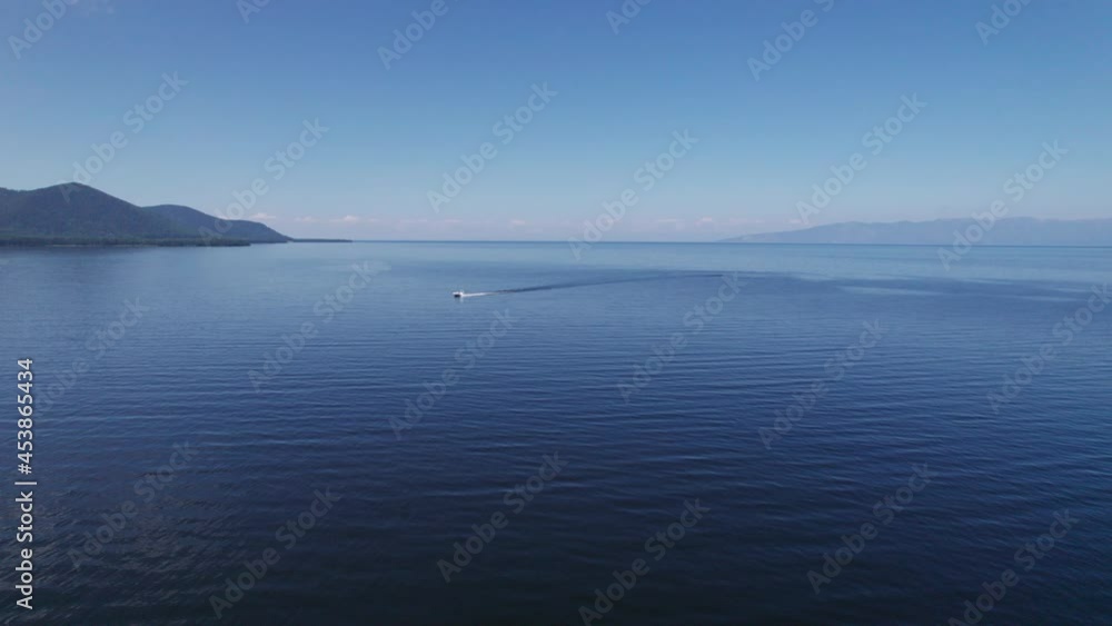 Summertime aerial imagery of Lake Baikal is a rift lake located in southern Siberia, Russia Baikal lake summer landscape view. Drone's Eye View. Summertime aerial imagery of Lake Baikal is a rift lake located in southern Siberia, Russia Baikal lake summer landscape view. Drone's Eye View.