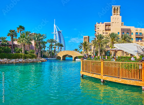 The view of Burj al Arab behind the canal of Souk Madinat Jumeirah market, Dubai, UAE photo