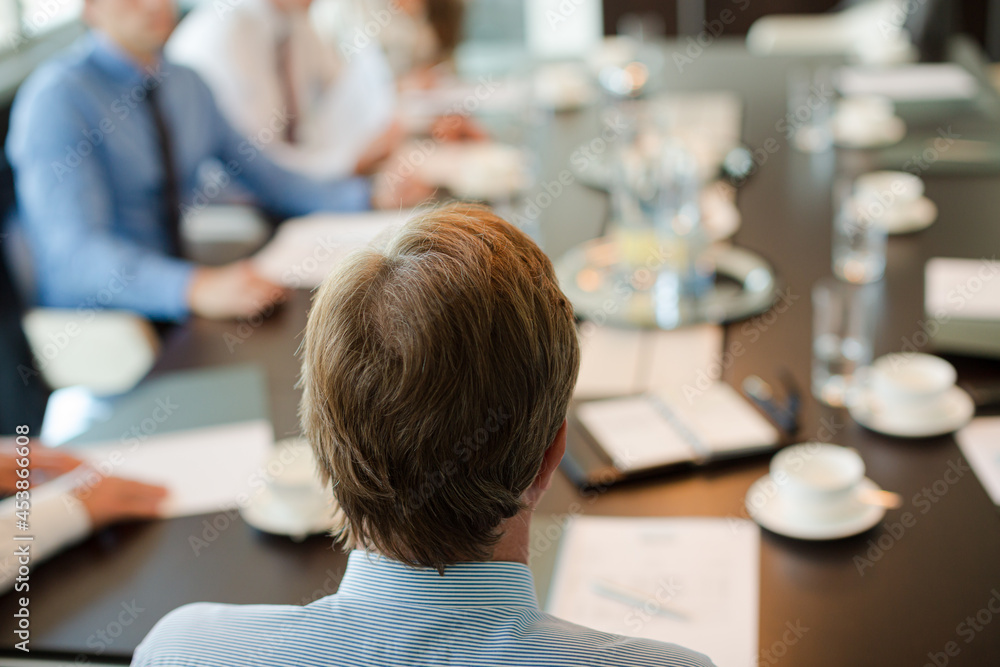 Business people sitting in meeting Business people sitting in meeting