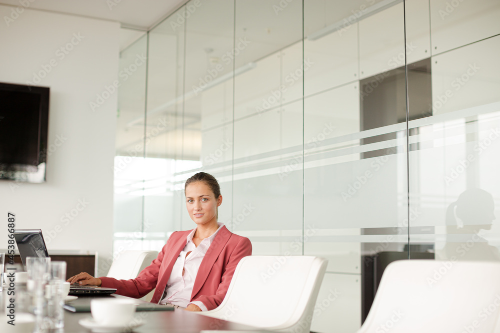 Businesswoman working at computer at desk Businesswoman working at computer at desk