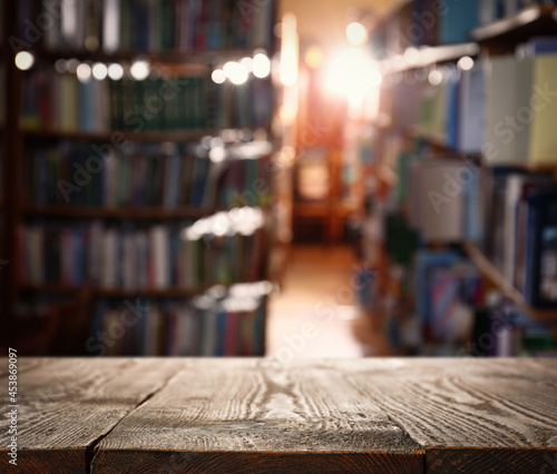 Empty wooden table in library. Space for design