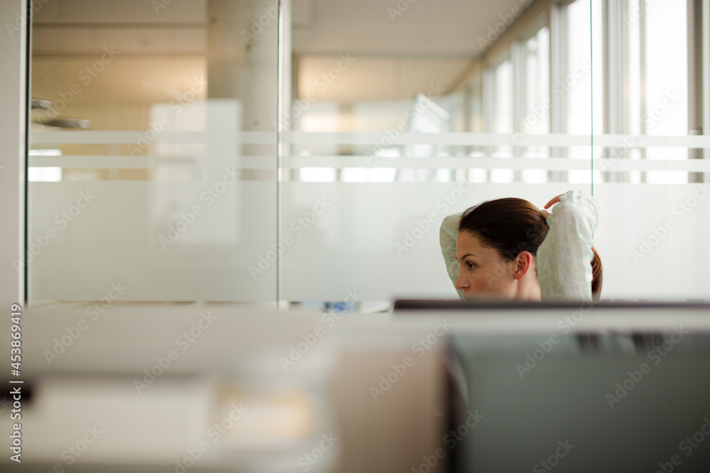 Businesswoman wearing headset at desk Businesswoman wearing headset at desk