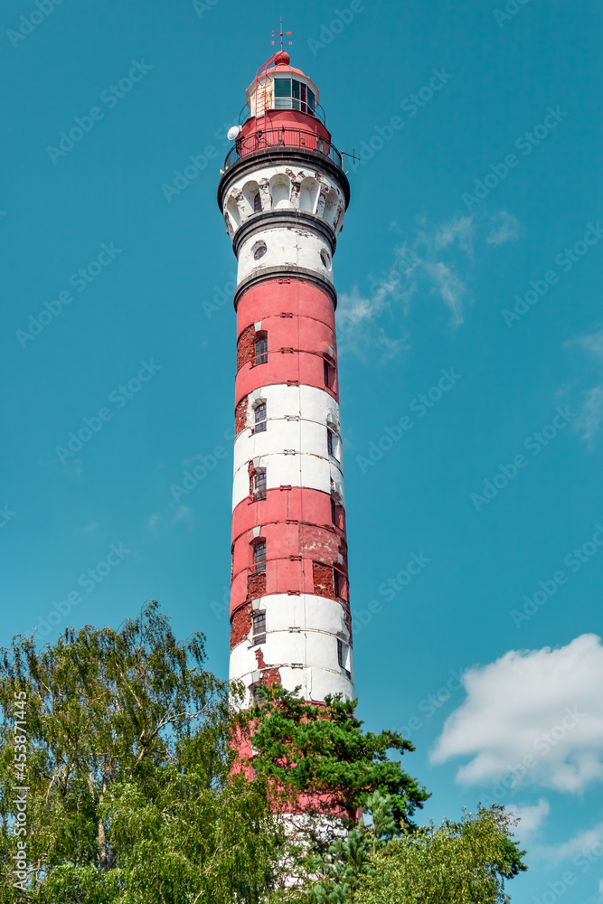 high sea lighthouse and blue sky in the background