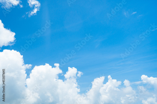 Beautiful white cloud with blue sky background.Bright blue sky background with tiny clouds.