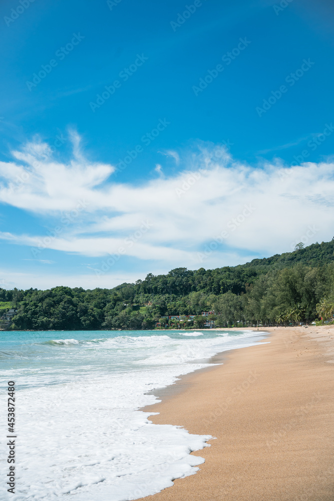 waves nature splashes sand beach on sunlight.blue sea and sky famous beach. waves nature splashes sand beach on sunlight.blue sea and sky famous beach.