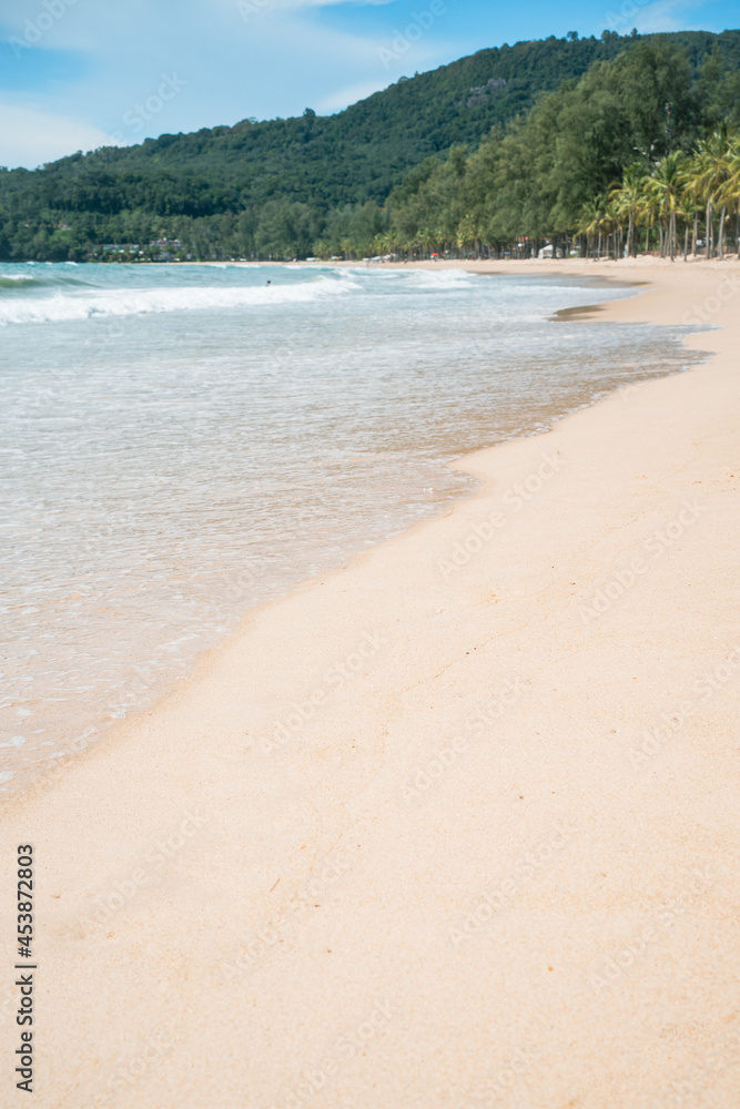 waves nature splashes sand beach on sunlight.blue sea and sky famous beach. waves nature splashes sand beach on sunlight.blue sea and sky famous beach.