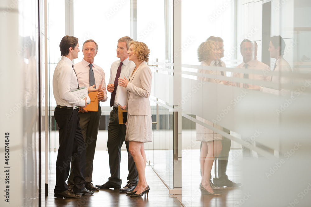Fototapeta premium Business people talking in office lobby area