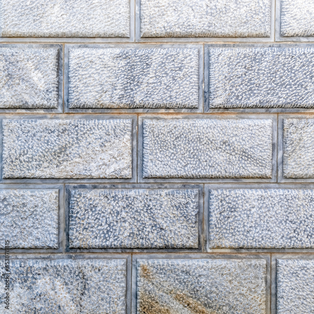 Naklejka premium light grey marble blocks wall, natural material seamless background