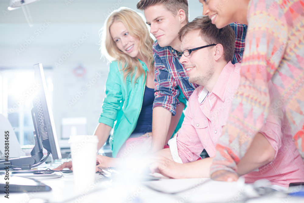 Business people working together at computer Business people working together at computer