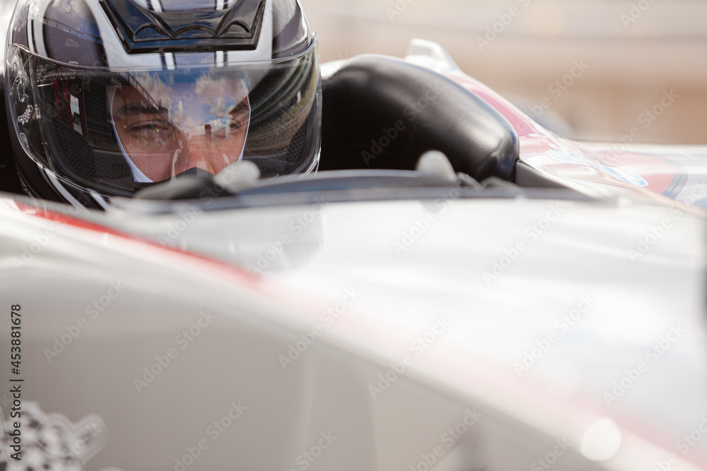 Close up of racer wearing helmet Close up of racer wearing helmet