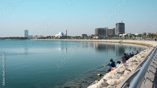  View from the new Khobar Corniche showing the water tower and some fishing hobbyists in the morning photo