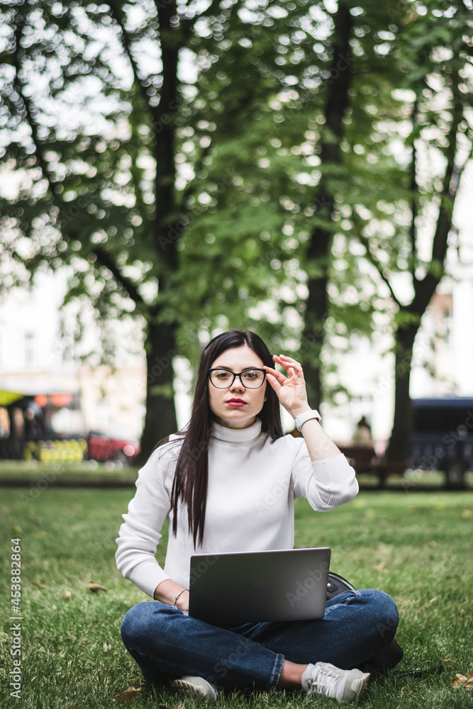 Caucasian Student girl working with a laptop Caucasian Student girl working with a laptop
