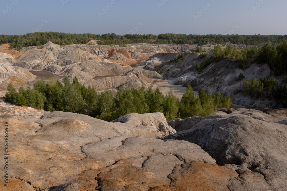 The clay quarry resembles a cosmic landscape.Ural Mars.An original landscape in the Sverdlovsk region in Russia.Top view of the hills made of refractory clay.A unique place created by man and nature