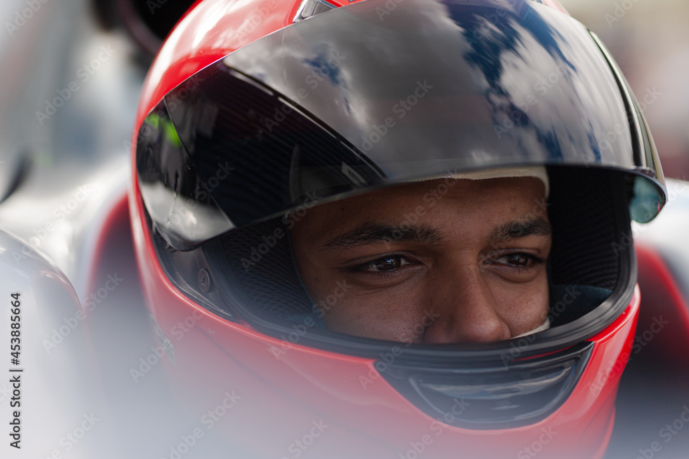 Close up of racer wearing helmet