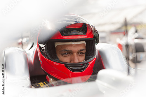 Fotografia Close up of racer wearing helmet