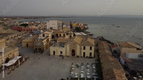 aerial view tour of the main square of Marzamemi, famous touristic little village in Sicily, Italy 