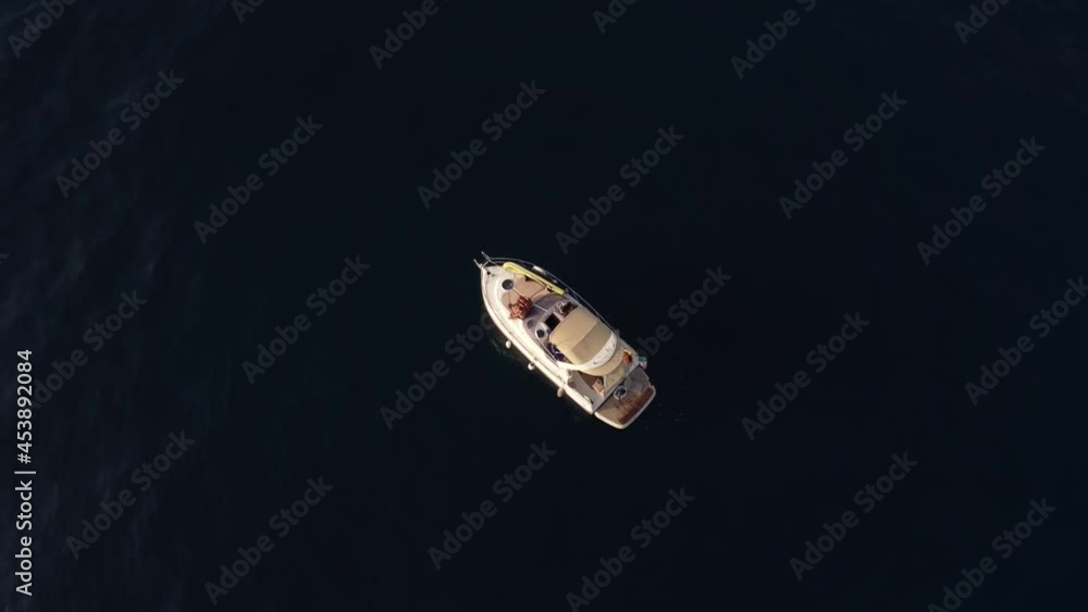 Rising and up and flying over a luxury motorboat in the mediterranean sea, Gulf of Catania, Sicily, Italy Rising and up and flying over a luxury motorboat in the mediterranean sea, Gulf of Catania, Sicily, Italy
