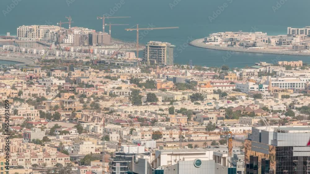 Aerial view of apartment houses and villas in Dubai city timelapse, United Arab Emirates Aerial view of apartment houses and villas in Dubai city timelapse, United Arab Emirates
