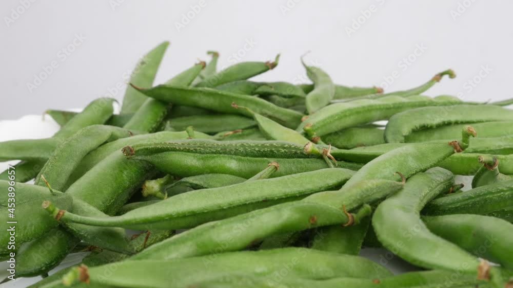Close shot of green beans, Green beans isolated over white plate Close shot of green beans, Green beans isolated over white plate
