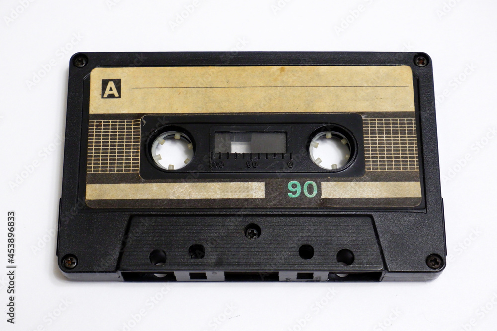 Obraz premium Old audio cassette on a white background. Compact cassette