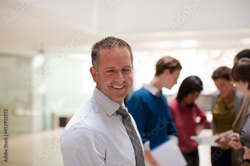 Businessman smiling in meeting © KOTO