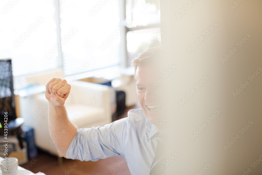 Fototapeta premium Businessman sitting at desk in office