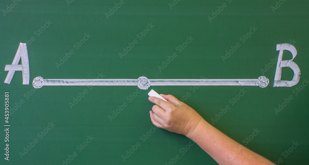 A straight segment with two points A and B drawn in white chalk on a green blackboard close-up and space for copying