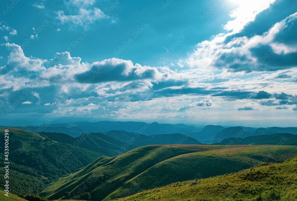 Naklejka premium landscape with mountains and clouds