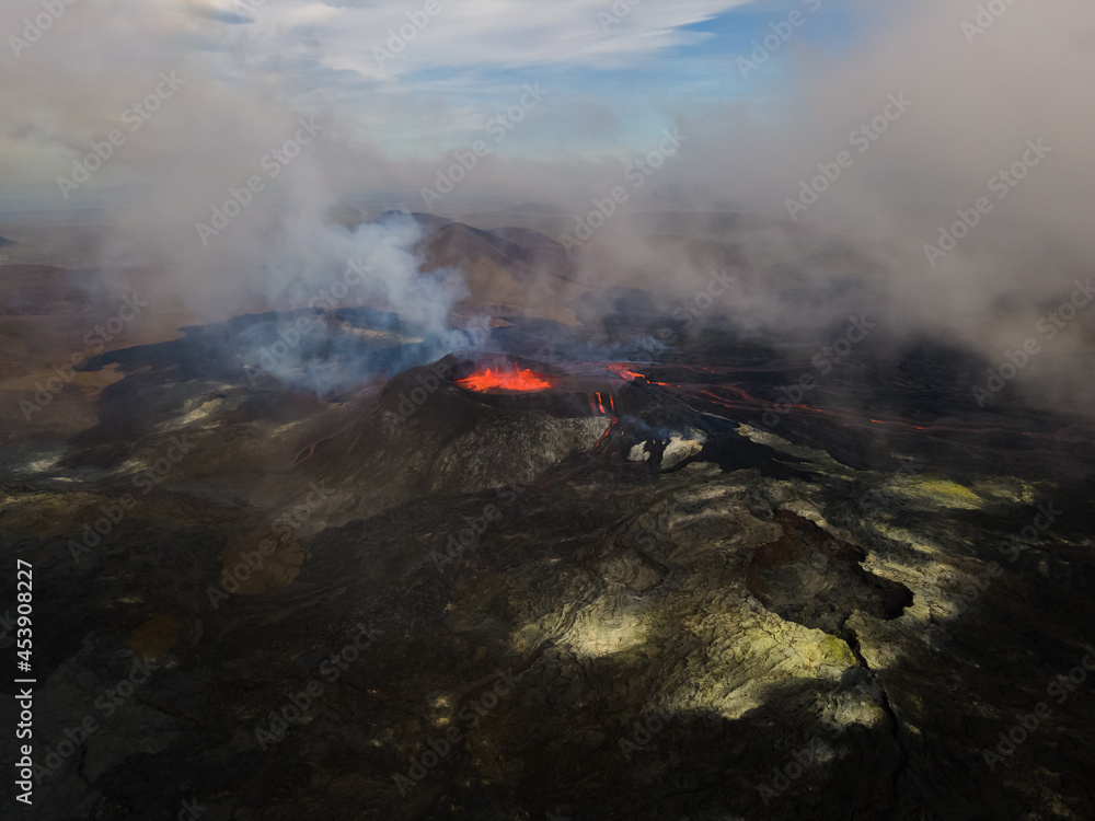 Fototapeta premium Impressive aerial view of the exploding red lava from the Active Volcano in Iceland