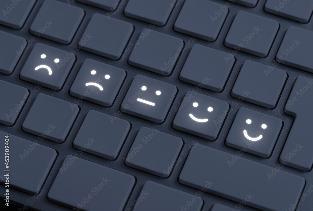 Rating feedback emotions glowing on dark keyboard, unsatisfied to satisfied Rating feedback emotions glowing on dark keyboard, unsatisfied to satisfied