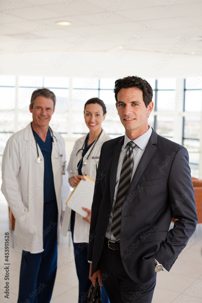 Doctor and businesswoman handshaking in meeting Doctor and businesswoman handshaking in meeting