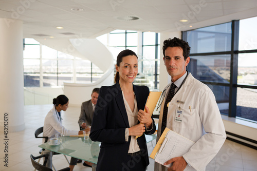 Doctors talking in hospital corridor