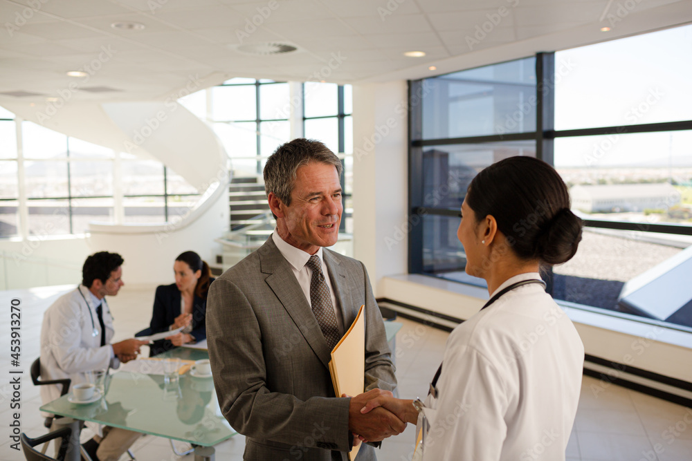Nurse and aging patient talking in hospital room Nurse and aging patient talking in hospital room